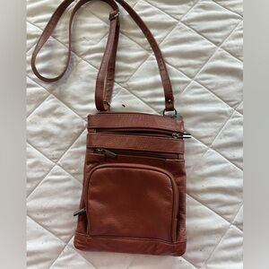 Multi pocket cross body faux leather purse